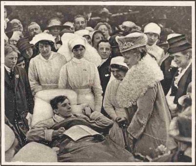 Queen Mary talking to disabled patients at the opening of the Princess Alice Home on 5th May 1919, from The Sketch, May 14th 1919